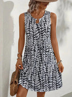 Midi zomerjurk dames, mouwloos met abstracte print en A-lijn