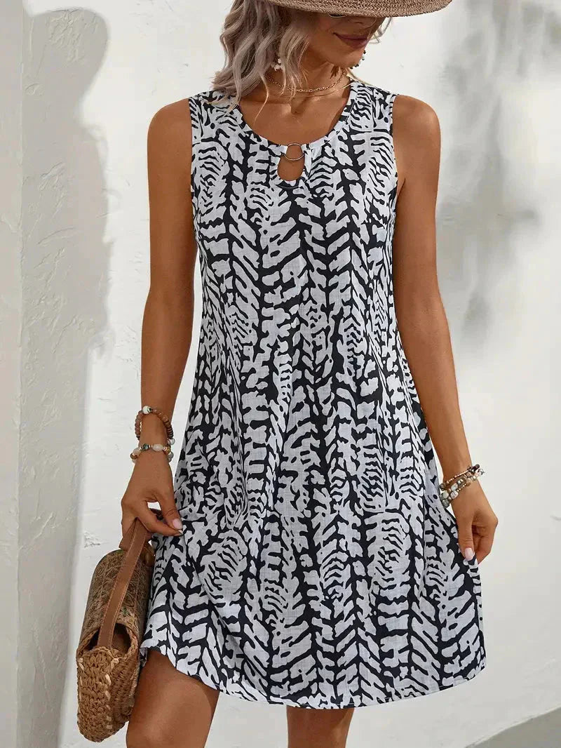 Midi zomerjurk dames, mouwloos met abstracte print en A-lijn
