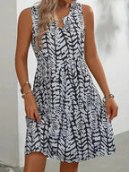 Midi zomerjurk dames, mouwloos met abstracte print en A-lijn
