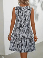 Midi zomerjurk dames, mouwloos met abstracte print en A-lijn