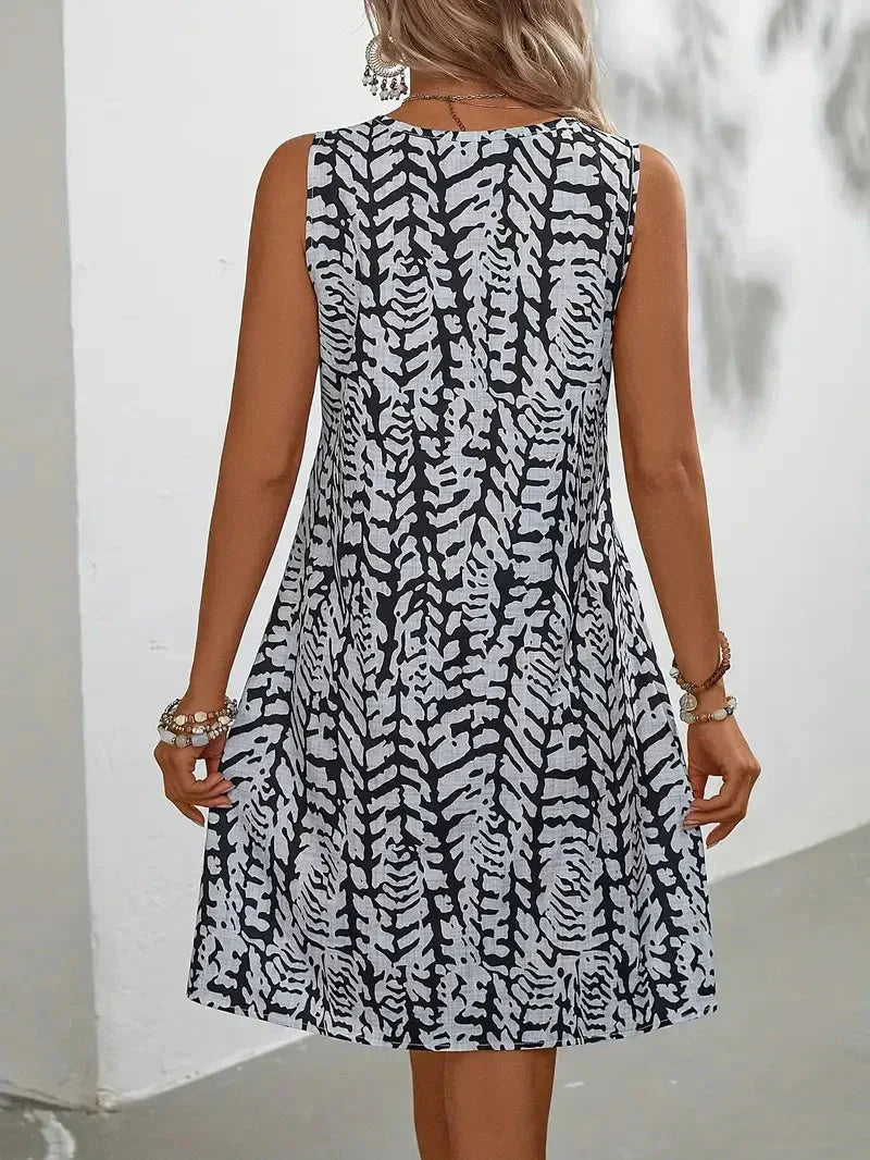 Midi zomerjurk dames, mouwloos met abstracte print en A-lijn